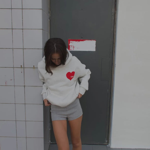 Elevate your off-duty style with the SŚAINT Grey Heart Hoodie – where comfort meets bold design. Crafted from a soft and durable 50% cotton, 50% polyester blend, this fleece-lined hoodie is the perfect throw-on for cooler days.