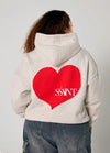 Elevate your off-duty style with the SŚAINT Grey Heart Hoodie – where comfort meets bold design. Crafted from a soft and durable 50% cotton, 50% polyester blend, this fleece-lined hoodie is the perfect throw-on for cooler days.