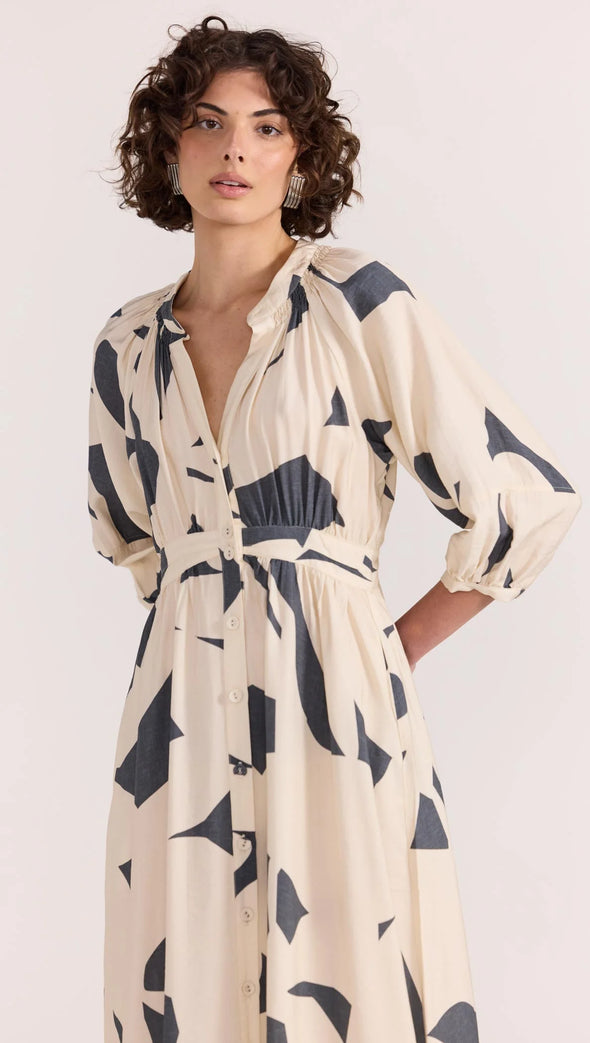 Introducing the Aura Midi Dress - the perfect combination of style and ease. Cut from a lightweight fabric in our exclusive abstract print, this dress effortlessly transitions from casual days to special occasions. With a button-through front, gathered waist, and soft sleeve volume, it's the epitome of throw-on-and-wow.