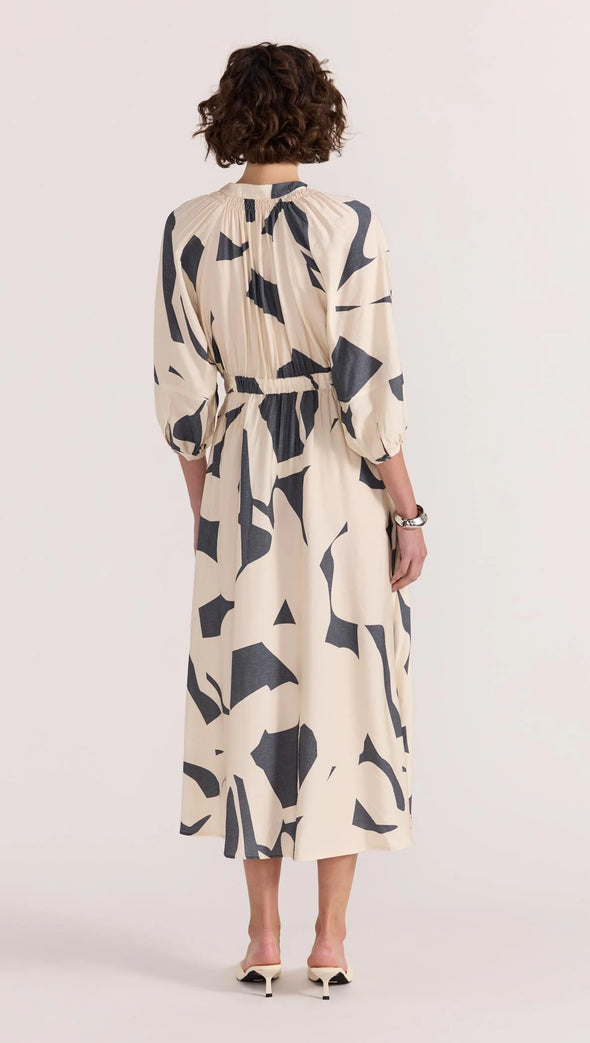 Introducing the Aura Midi Dress - the perfect combination of style and ease. Cut from a lightweight fabric in our exclusive abstract print, this dress effortlessly transitions from casual days to special occasions. With a button-through front, gathered waist, and soft sleeve volume, it's the epitome of throw-on-and-wow.