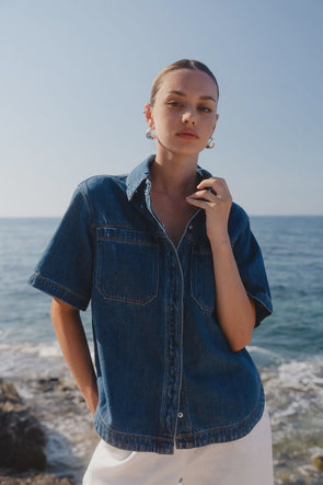 100% cotton for natural softness and breathability

Relaxed short sleeves for all-day comfort

Oversized chest pockets with utilitarian detail

Button front for versatile layering and styling