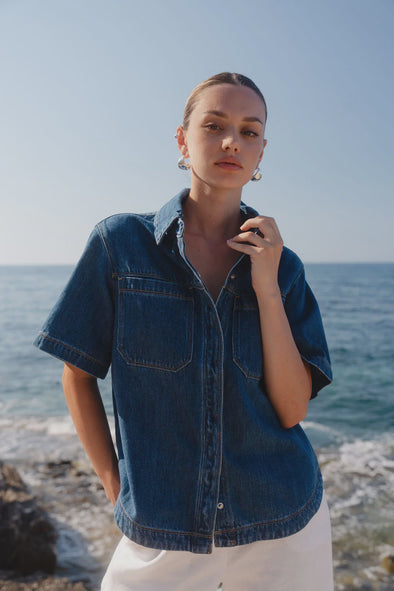 100% cotton for natural softness and breathability

Relaxed short sleeves for all-day comfort

Oversized chest pockets with utilitarian detail

Button front for versatile layering and styling