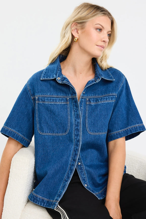 100% cotton for natural softness and breathability

Relaxed short sleeves for all-day comfort

Oversized chest pockets with utilitarian detail

Button front for versatile layering and styling