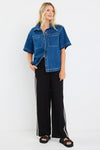 100% cotton for natural softness and breathability

Relaxed short sleeves for all-day comfort

Oversized chest pockets with utilitarian detail

Button front for versatile layering and styling