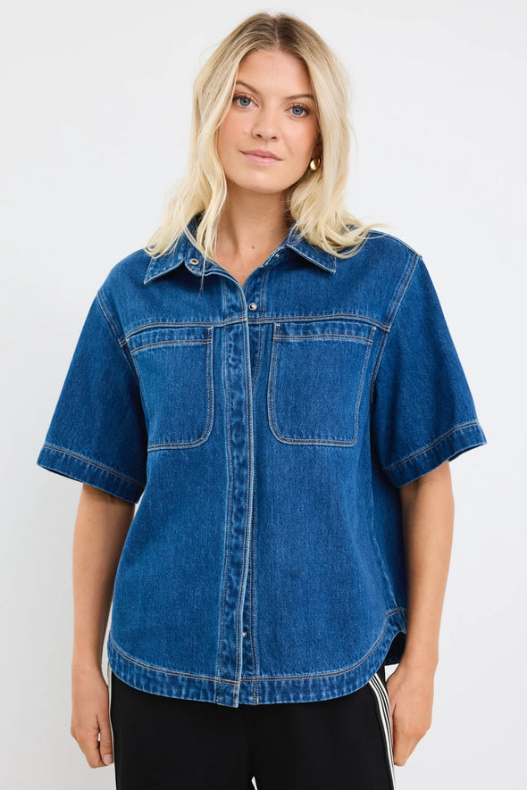 100% cotton for natural softness and breathability

Relaxed short sleeves for all-day comfort

Oversized chest pockets with utilitarian detail

Button front for versatile layering and styling