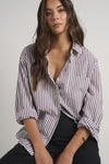 Effortlessly elevate your style with our fresh take on a classic button-up. The modern chocolate and white pinstripes add a touch of sophistication, while the lightweight fabric keeps you comfortable. Whether worn loose or tucked in, this versatile shirt is perfect for both polished office wear and casual weekends.