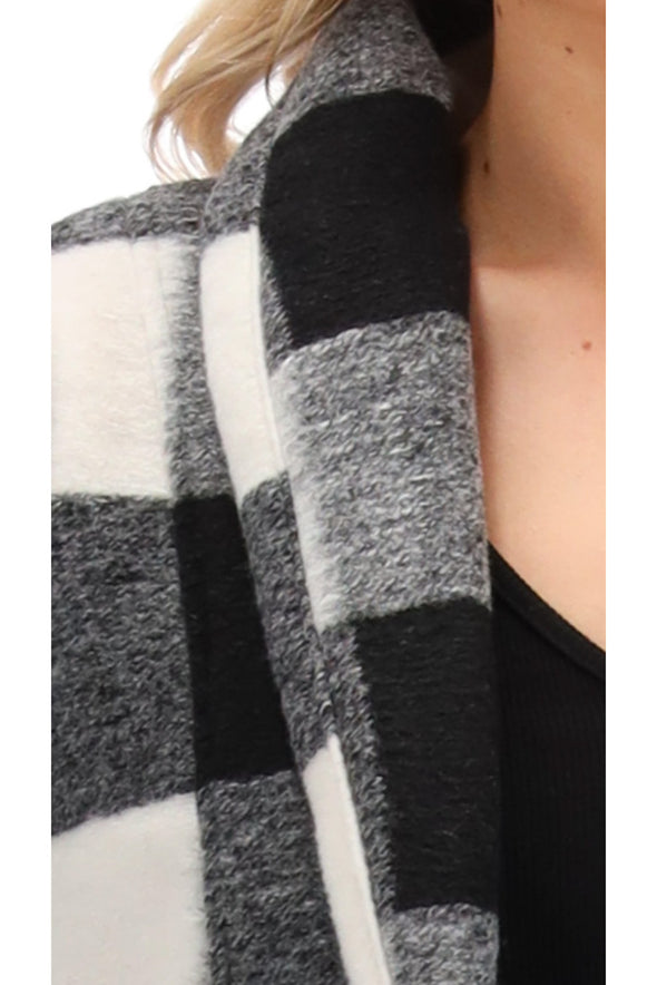 We are loving on this long line Black and White Check cardigan from Charlo! With the cutiest check and a snuggly feel who wouldnt want one of these for their wardrobe. Just realised and we cannot get anymore. Standard sizing , stick to your normal size&nbsp;