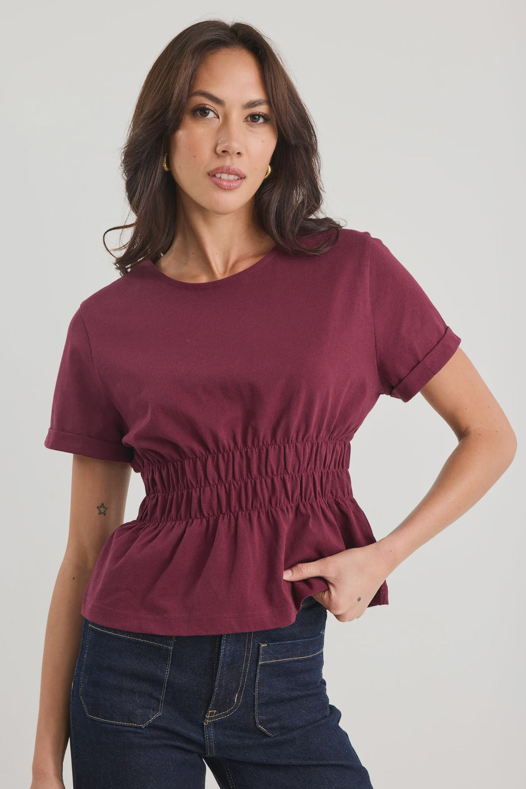 The Svelte Tee elevates the classic cotton essential with thoughtful design details. Crafted from breathable 100% cotton, this piece features a gently shirred waist that creates a flattering silhouette, paired with a softly flared hem for movement and grace. Finished with cuffed short sleeves and a refined crew neckline, it strikes the perfect balance between casual comfort and understated elegance. Versatile enough to pair with tailored trousers, flowing skirts, or your favourite denim, the Svelte Tee beco