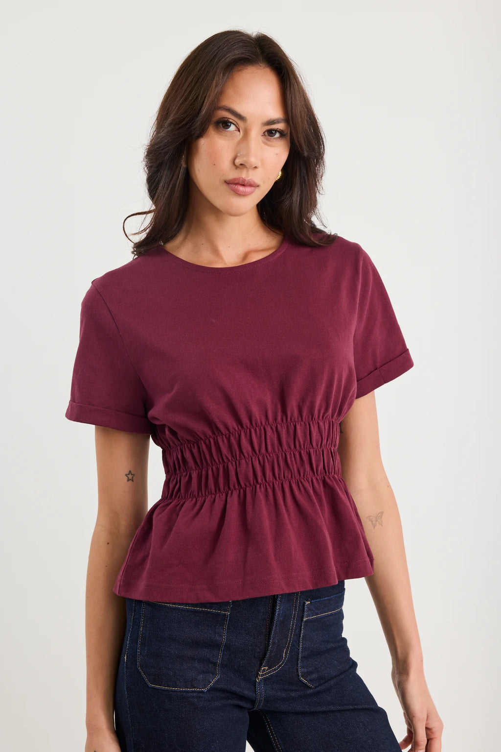 The Svelte Tee elevates the classic cotton essential with thoughtful design details. Crafted from breathable 100% cotton, this piece features a gently shirred waist that creates a flattering silhouette, paired with a softly flared hem for movement and grace. Finished with cuffed short sleeves and a refined crew neckline, it strikes the perfect balance between casual comfort and understated elegance. Versatile enough to pair with tailored trousers, flowing skirts, or your favourite denim, the Svelte Tee beco