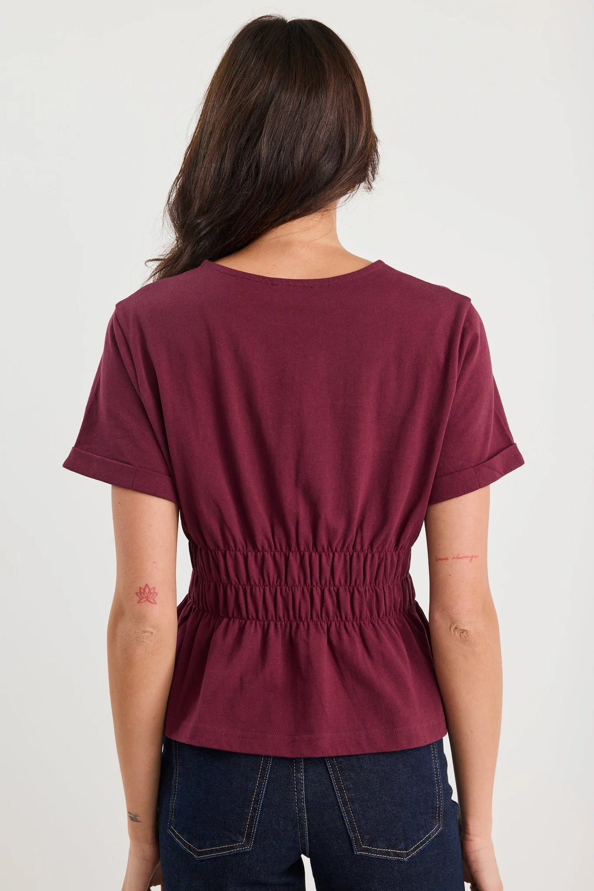 The Svelte Tee elevates the classic cotton essential with thoughtful design details. Crafted from breathable 100% cotton, this piece features a gently shirred waist that creates a flattering silhouette, paired with a softly flared hem for movement and grace. Finished with cuffed short sleeves and a refined crew neckline, it strikes the perfect balance between casual comfort and understated elegance. Versatile enough to pair with tailored trousers, flowing skirts, or your favourite denim, the Svelte Tee beco