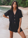 Get beach-ready in style with Volcom's Easy Breezy Romper. Made with airy cotton gauze, this romper is perfect for throwing over your swimwear or wearing alone. The tailored design, complete with a collar and front buttons, offers a relaxed and effortless fit. Featured in classic black.