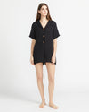 Get beach-ready in style with Volcom's Easy Breezy Romper. Made with airy cotton gauze, this romper is perfect for throwing over your swimwear or wearing alone. The tailored design, complete with a collar and front buttons, offers a relaxed and effortless fit. Featured in classic black.