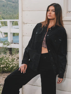 The Roadstop Jacket is a versatile trucker jacket that combines style and functionality. Made of un-cut corduroy, this oversized jacket features denim detailing, pleated balloon sleeves, and adjustable waist tabs at the back waistband. This jacket is perfect for layering up and staying warm this fall.