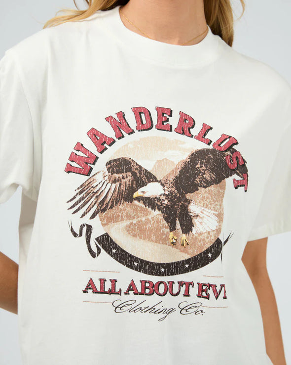 Get ready for some wanderlust with the Wanderlust Oversized Tee. Its distressed print adds a vintage touch and pairs perfectly with your favorite denim for a relaxed, effortless look. In a vintage white giving the print that worn edge. This soft tee is sure to be your go-to for laid-back days.

Oversized fit
Front print
Distressed graphics