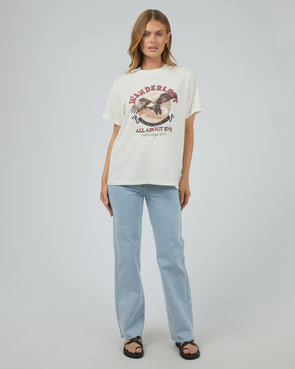 Get ready for some wanderlust with the Wanderlust Oversized Tee. Its distressed print adds a vintage touch and pairs perfectly with your favorite denim for a relaxed, effortless look. In a vintage white giving the print that worn edge. This soft tee is sure to be your go-to for laid-back days.

Oversized fit
Front print
Distressed graphics