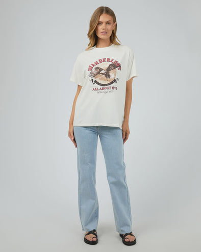 Get ready for some wanderlust with the Wanderlust Oversized Tee. Its distressed print adds a vintage touch and pairs perfectly with your favorite denim for a relaxed, effortless look. In a vintage white giving the print that worn edge. This soft tee is sure to be your go-to for laid-back days.

Oversized fit
Front print
Distressed graphics