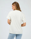 Get ready for some wanderlust with the Wanderlust Oversized Tee. Its distressed print adds a vintage touch and pairs perfectly with your favorite denim for a relaxed, effortless look. In a vintage white giving the print that worn edge. This soft tee is sure to be your go-to for laid-back days.

Oversized fit
Front print
Distressed graphics