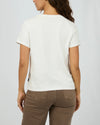 The Western Dreamer Regular Tee captures laid-back desert vibes with its crisp white fabric and playful western stamp-style prints. Its relaxed fit is perfect for tucking into denim cutoffs or layering under a slip dress, adding a subtle touch of western charm to your everyday style. Effortlessly cool and ready for any adventure!