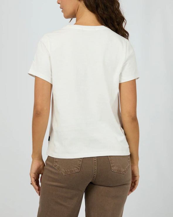 The Western Dreamer Regular Tee captures laid-back desert vibes with its crisp white fabric and playful western stamp-style prints. Its relaxed fit is perfect for tucking into denim cutoffs or layering under a slip dress, adding a subtle touch of western charm to your everyday style. Effortlessly cool and ready for any adventure!