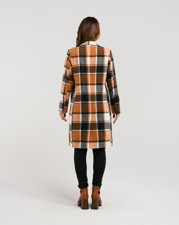 Add a pop of color to your winter wardrobe with our knee-length wool-blend coat! Its classic, elegant style is elevated by a striking orange and black plaid fabric. Perfect for the fashion-forward who still appreciate timeless sophistication.&nbsp;