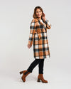 Add a pop of color to your winter wardrobe with our knee-length wool-blend coat! Its classic, elegant style is elevated by a striking orange and black plaid fabric. Perfect for the fashion-forward who still appreciate timeless sophistication.&nbsp;