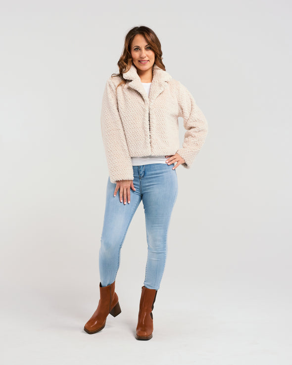 Introducing our luxurious Cozy Fluffy Jacket in light beige. This winter essential will keep you warm and stylish, with its chic design and soft fabric. Perfect for brightening up those cold days. Elevate your winter wardrobe with our exclusive jacket.