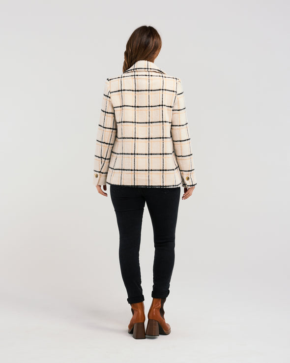 Stay stylish and warm all season in our effortlessly chic plaid coat. Made with soft fabric and shell buttons, this jacket also features convenient pockets. A must-have for any wardrobe!