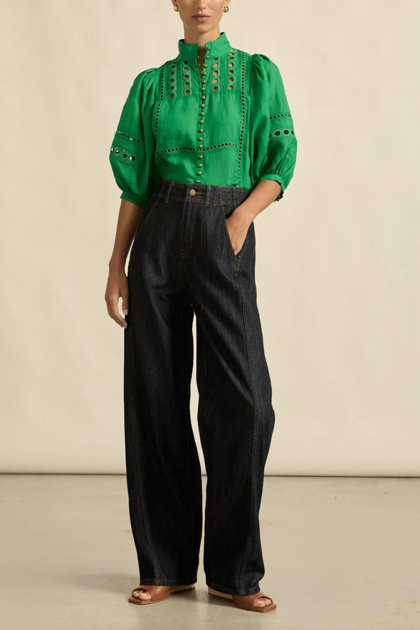 Circular lace trims and antique brass buttons bring a dash of romance to this effortlessly stylish top. The cabaret silhouette balances ornate details with everyday wearability, making it a playful favourite that adds high-impact charm without any fuss.
