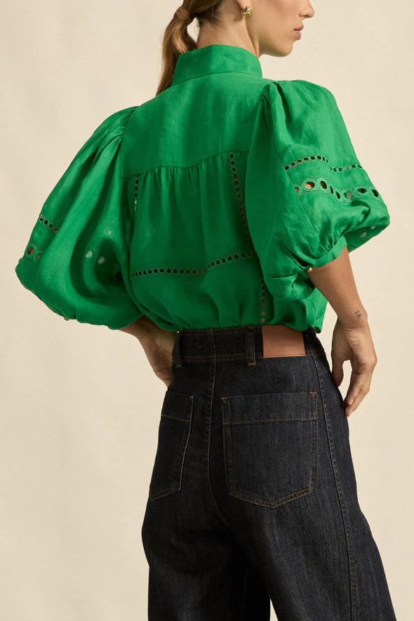 Circular lace trims and antique brass buttons bring a dash of romance to this effortlessly stylish top. The cabaret silhouette balances ornate details with everyday wearability, making it a playful favourite that adds high-impact charm without any fuss.