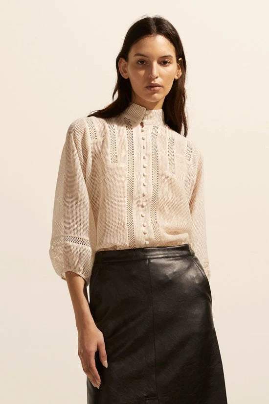 The Focus top in window grid fabric which is sheer, high stand collar , covered buttons and lace trim detailing with grid style desig Ecru in colour 