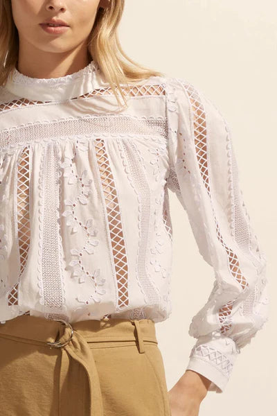 Equally parts modest and playful, crafted in our custom cotton broderie with delicate 3d detailing the fabric is truly the hero of this signature piece. It contrasts bold scalloped details with delicate sheer sections and small 3d leaves for an on-trend yet feminine edge