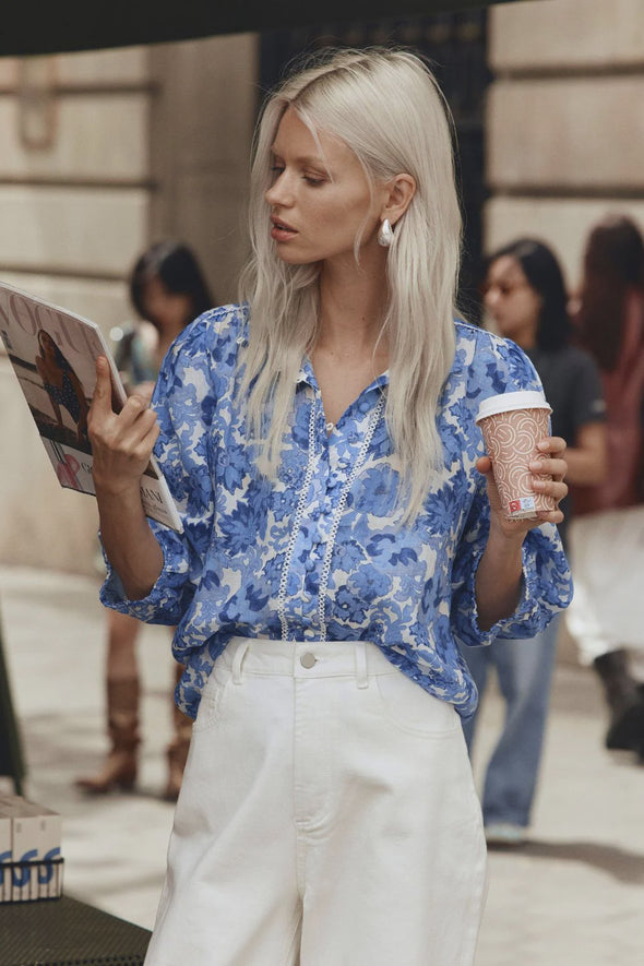 Looking for a bit of WOW factor? Then look no further. The versatile and feminine Outlook Top. Made of 100% ramie and trimmed with delicate lace, this button-down pairs perfectly with denim, tailored pants, or a simple skirt. The blouson sleeve with elasticated cuff allows for customisable styling. Elevate your off-duty, office, and event looks with this romantic piece.