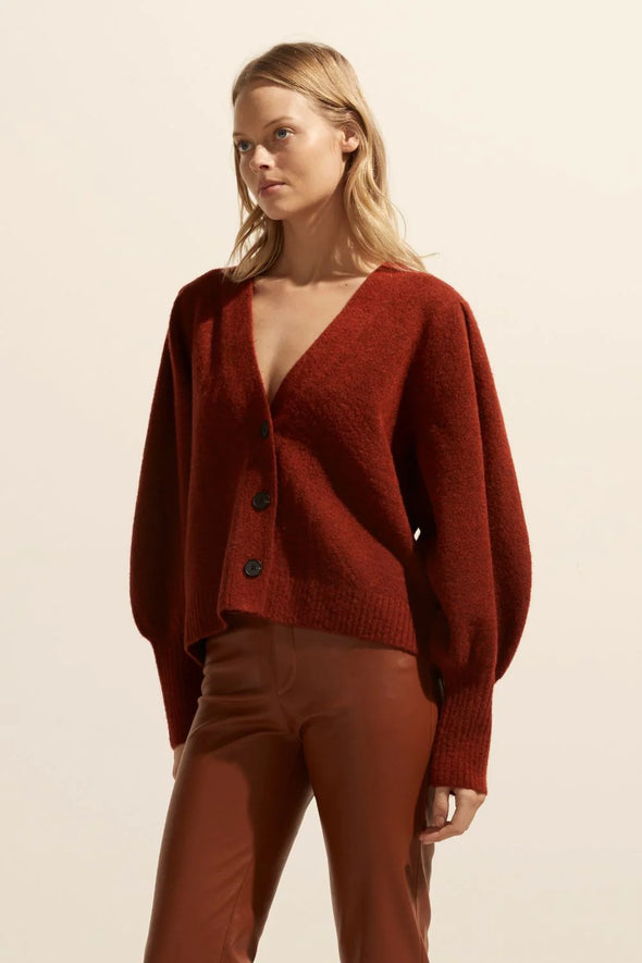 a deep v-neck, soft blouson sleeve and cropped length ensures the wander is both chic yet casual. wear this versatile knit alone as a fashion statement, or as a layering piece between seasons. see product details below. Colour Clay, a earthy red