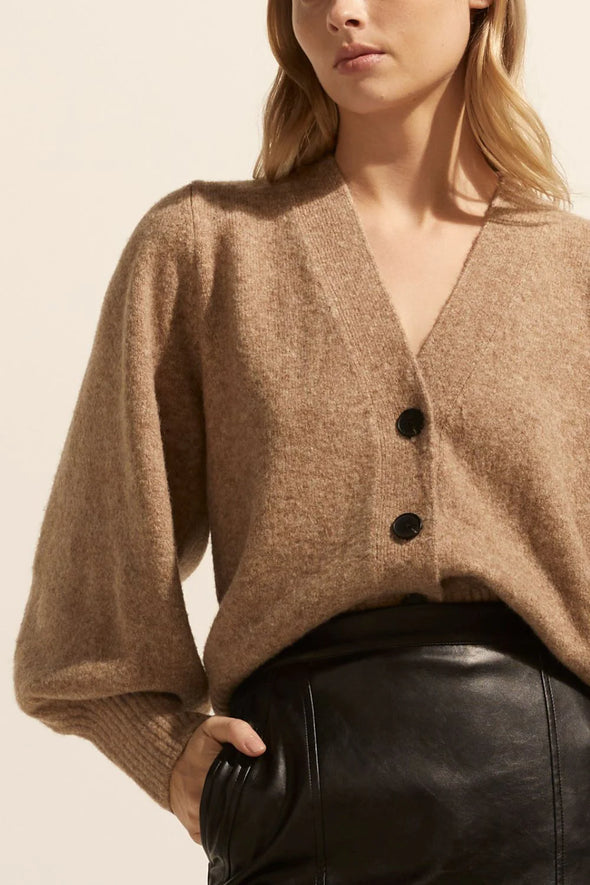 a deep v-neck, soft blouson sleeve and cropped length ensures the wander is both chic yet casual. wear this versatile knit alone as a fashion statement, or as a layering piece between seasons. see product details below. Colour Mousse, a soft brown/beige