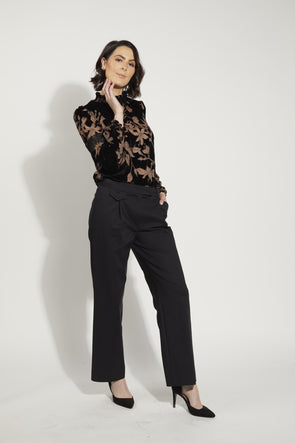 Heidi Blouse, a beloved staple in the wardrobes of many Drama Lovers. This exquisite blouse is now available in the beautiful Black Velvet fabric.&nbsp; Crafted with utmost attention to detail, the Heidi Blouse features a high elastic neck and elastic cuffs, ensuring a comfortable and flattering fit. Additionally, a delicate button adorns the back neckline, adding a touch of elegance to this timeless piece.