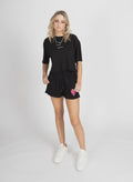 Our cropped little shorts are the perfect short shorts to own in summer. Pair with some cute trainers and an oversized tank. Featuring our Little Berry print right above the hem on the right leg.