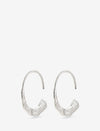 Ravishing and raw silver-plated earrings with a narrow, polished ring that transforms into a wider, flat hammered semicircle under your earlobe. The rustic texture lends character and exudes the power of the rocky Nordic landscape. Perfect as a stylish and compelling statement of feminine strength.